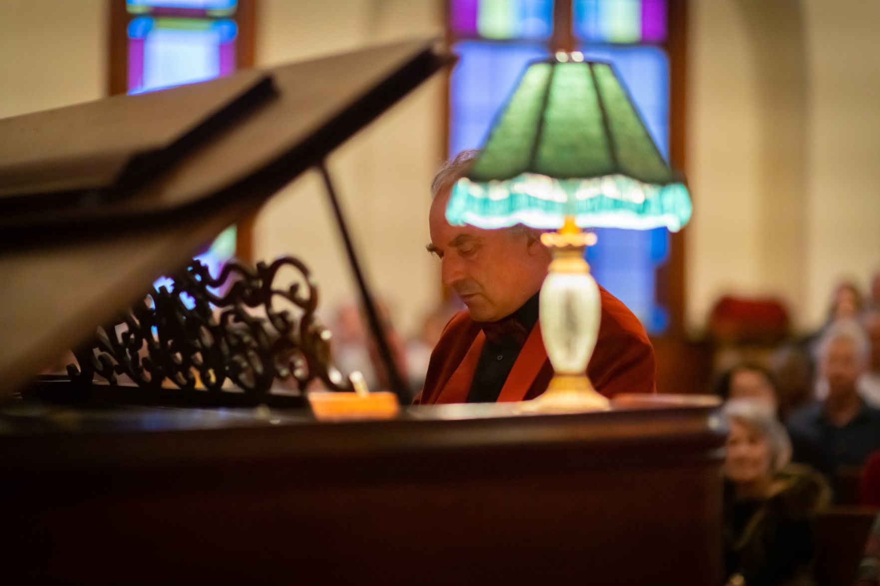 At the piano